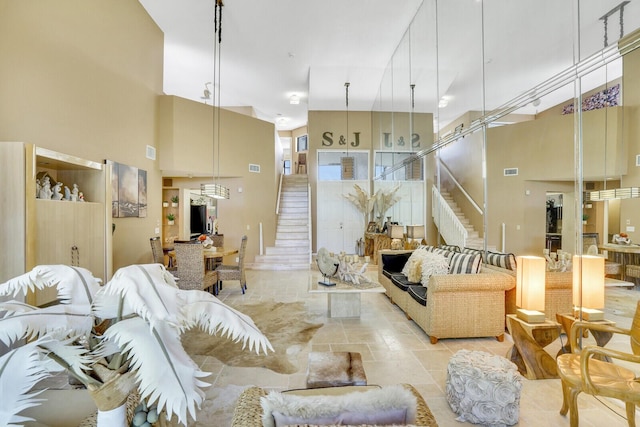 living room featuring a towering ceiling