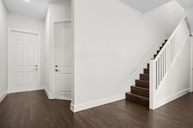 corridor with dark hardwood / wood-style floors