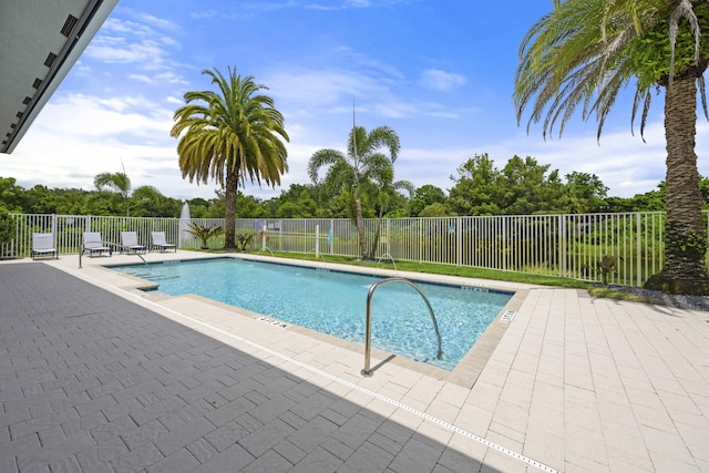 view of swimming pool with a patio