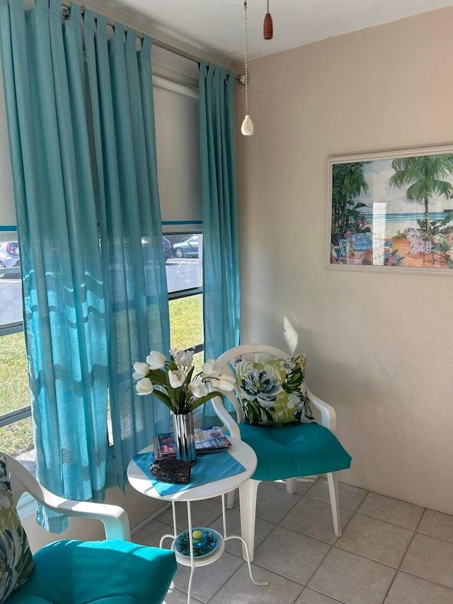 dining area featuring tile patterned floors and a healthy amount of sunlight