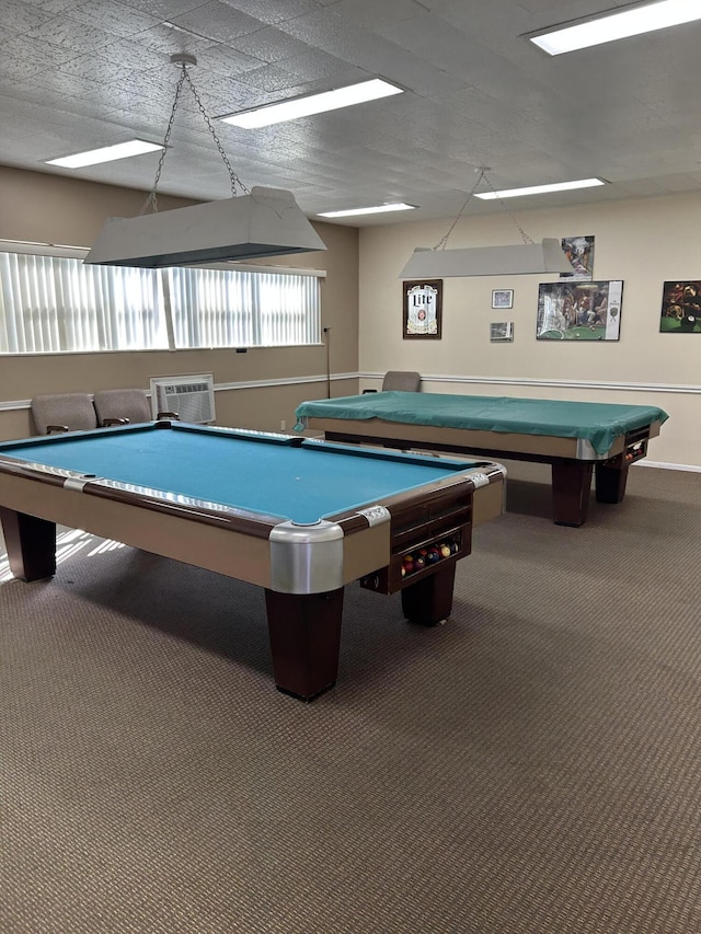 recreation room with a textured ceiling, carpet floors, and pool table