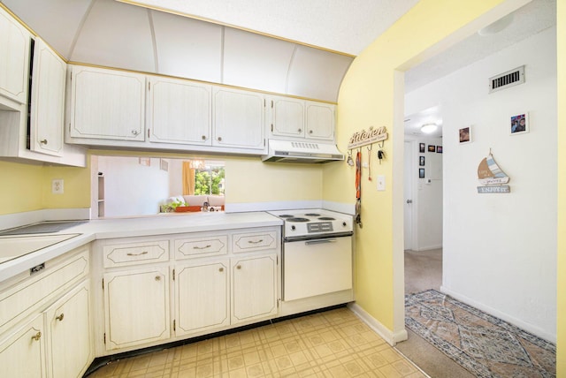 2581 N Garden Dr Unit 306, Lake Worth, FL 33461 - kitchen featuring under cabinet range hood, white range with electric stovetop, and light countertops