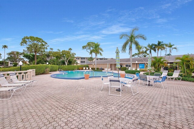2581 N Garden Dr Unit 306, Lake Worth, FL 33461 - community pool with a patio