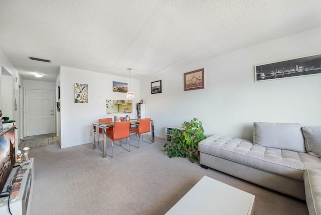 2581 N Garden Dr Unit 306, Lake Worth, FL 33461 - living area featuring carpet floors, an office area, a textured ceiling, and baseboards