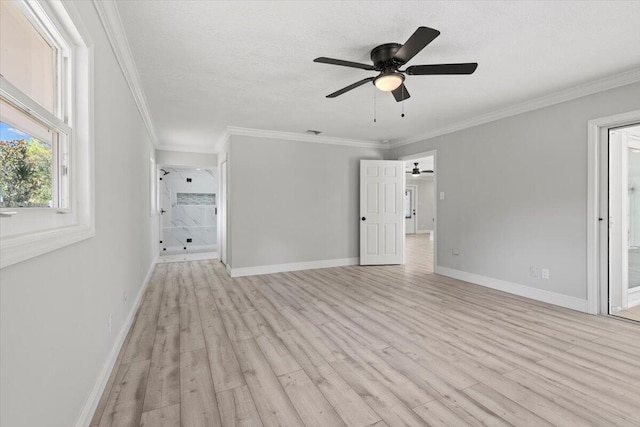 spare room featuring ceiling fan, light hardwood / wood-style floors, and crown molding