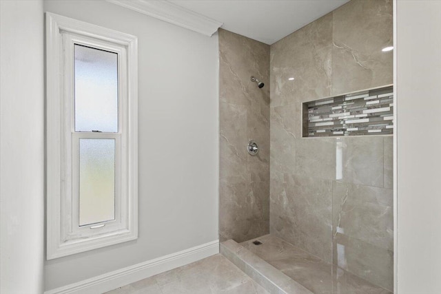 bathroom with tile patterned floors and a tile shower