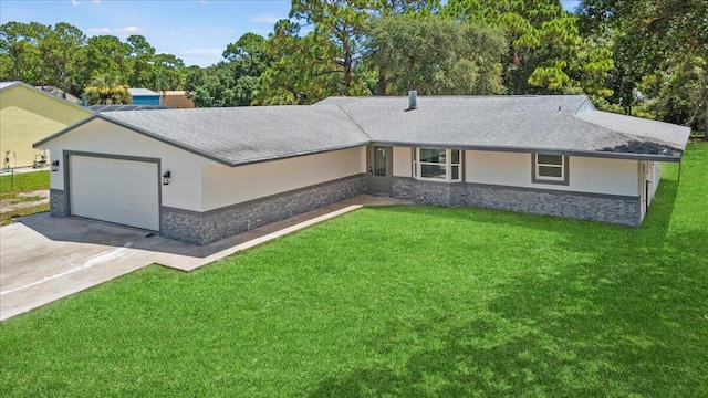 ranch-style house featuring a front yard and a garage