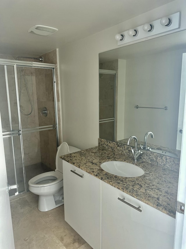 41 SE 5th St Unit 2017, Miami, FL 33131 - full bath featuring vanity, toilet, and a stall shower