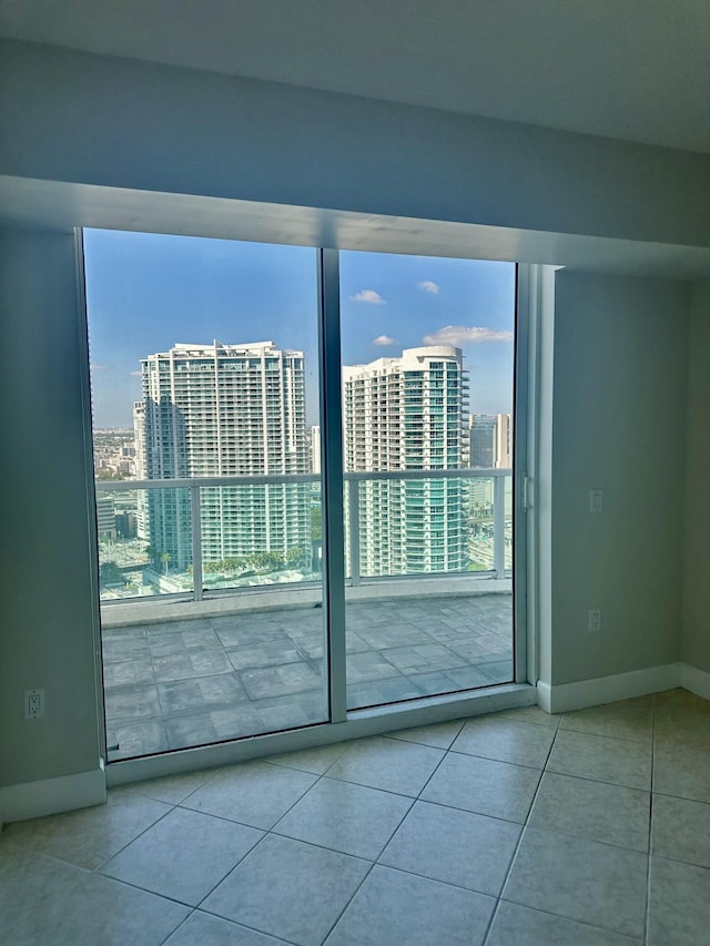 41 SE 5th St Unit 2017, Miami, FL 33131 - tiled empty room featuring a view of city and baseboards