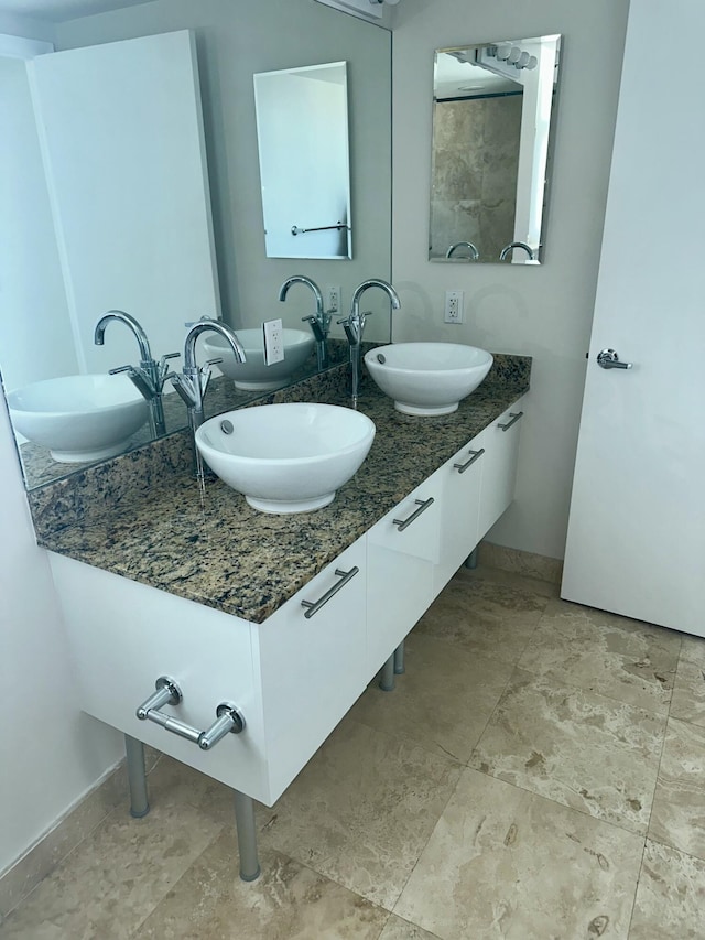 41 SE 5th St Unit 2017, Miami, FL 33131 - full bathroom with double vanity and baseboards