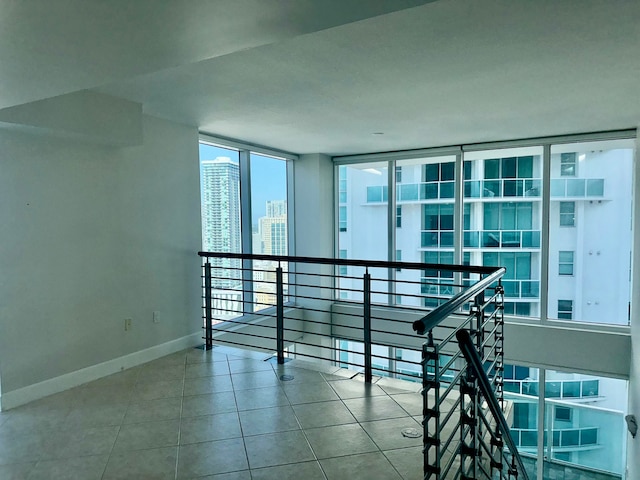 interior space featuring tile patterned floors and expansive windows