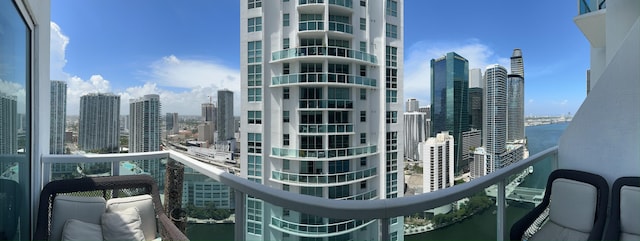 balcony featuring a water view