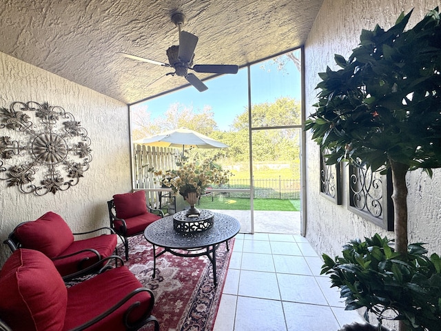 sunroom with ceiling fan and a healthy amount of sunlight