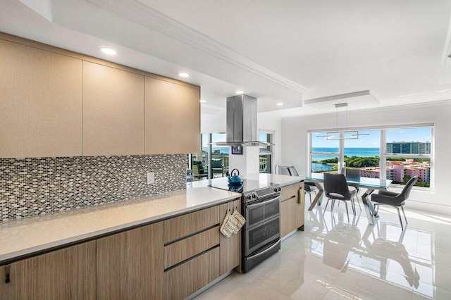 kitchen featuring ornamental molding, electric range oven, island exhaust hood, decorative light fixtures, and decorative backsplash