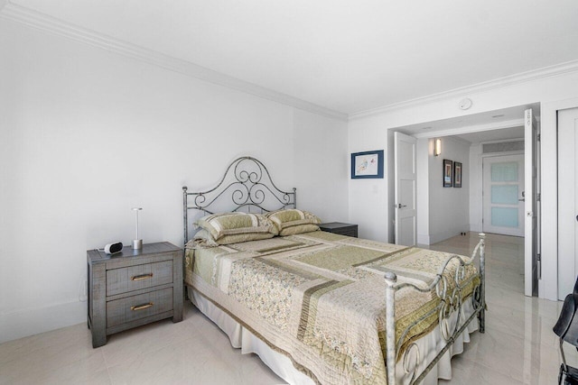 bedroom with crown molding and light tile patterned floors