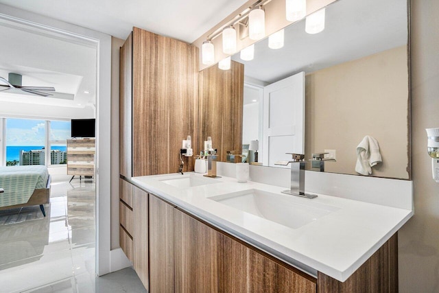 bathroom featuring ceiling fan, vanity, and tile patterned floors