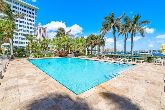 view of swimming pool with a patio area