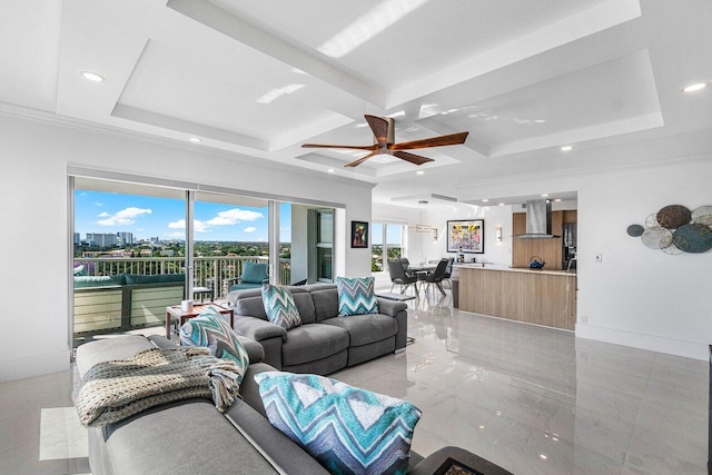 living room with beamed ceiling, coffered ceiling, and ceiling fan