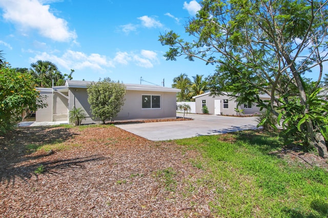 rear view of property featuring a patio area