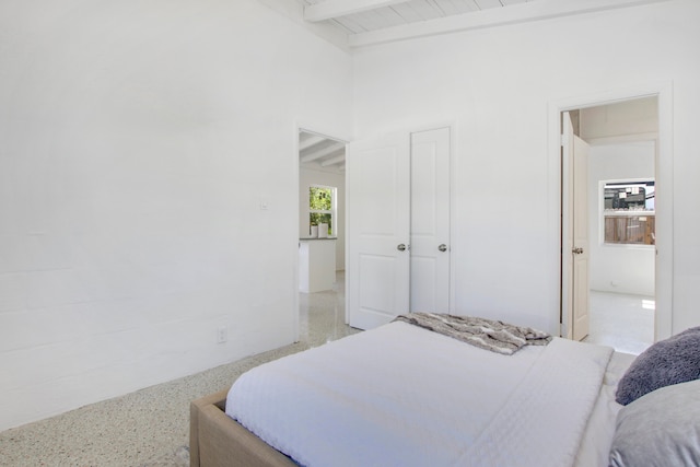 bedroom with beam ceiling