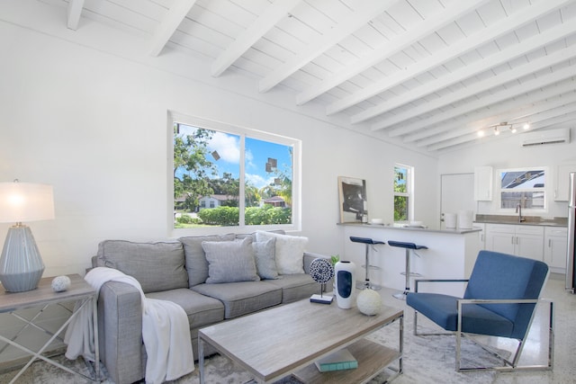 living room featuring lofted ceiling with beams and a wall mounted air conditioner