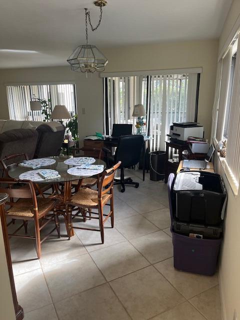 dining space featuring light tile patterned floors