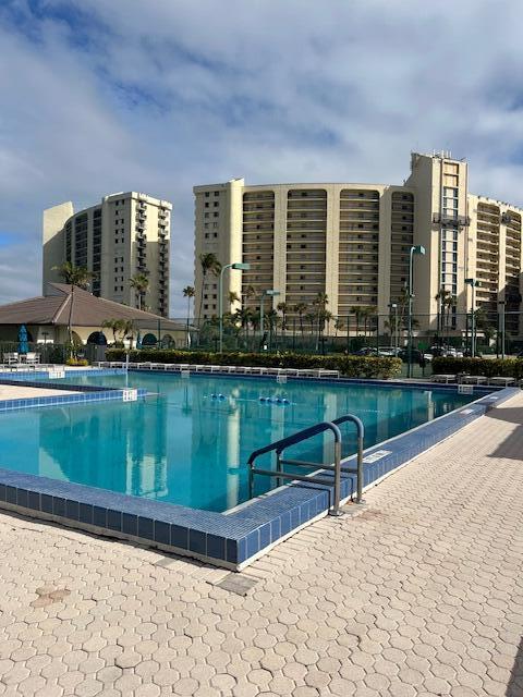 view of swimming pool with a city view