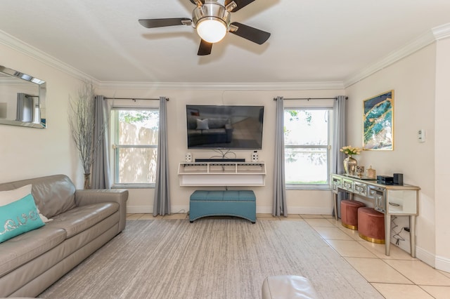 tiled living room featuring plenty of natural light, ceiling fan, and ornamental molding