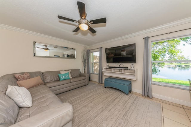 tiled living room featuring ceiling fan and crown molding