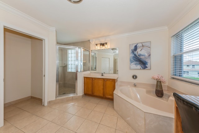 bathroom featuring tile patterned floors, vanity, shower with separate bathtub, and crown molding