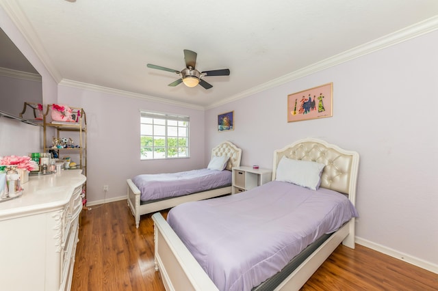 bedroom with ceiling fan, dark hardwood / wood-style floors, and crown molding