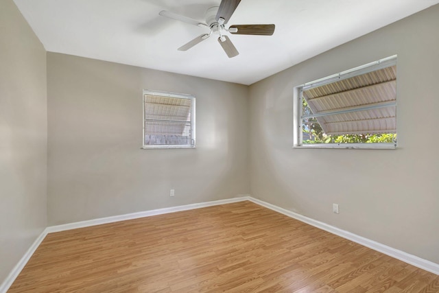 spare room with ceiling fan and light hardwood / wood-style floors