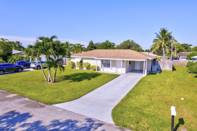 single story home with a carport and a front lawn