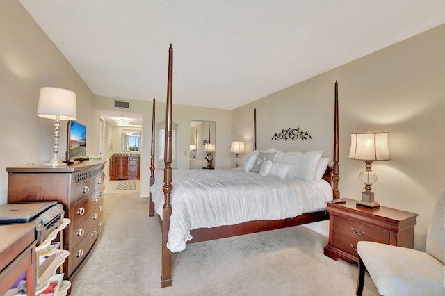 bedroom featuring light colored carpet