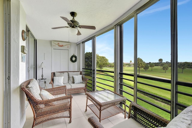 sunroom with ceiling fan