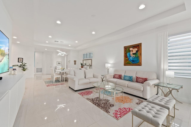 living room with a raised ceiling