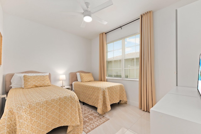 tiled bedroom with ceiling fan