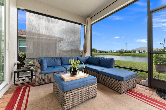 sunroom / solarium featuring a water view