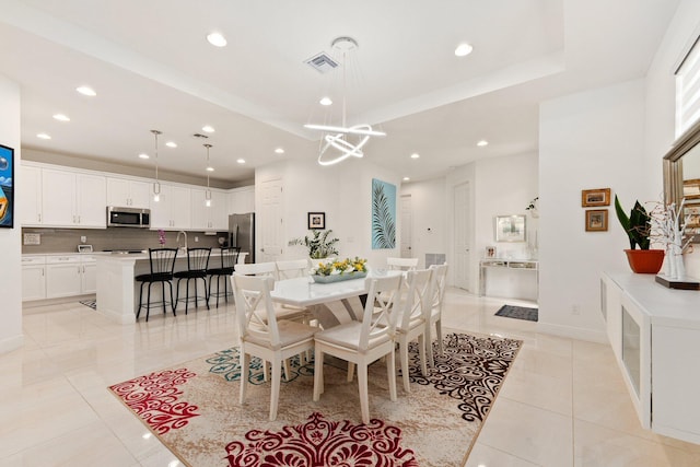 dining area with light tile patterned floors