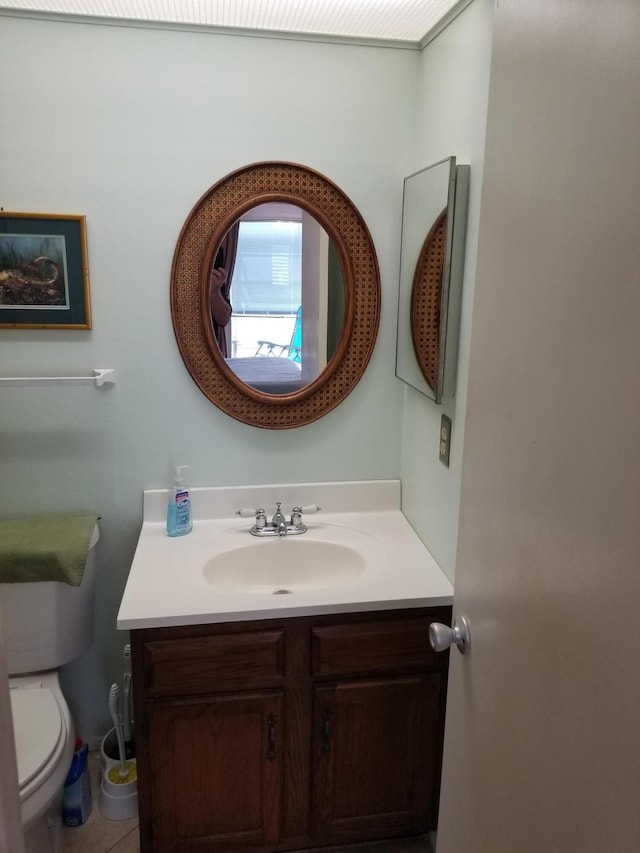 bathroom with vanity and toilet