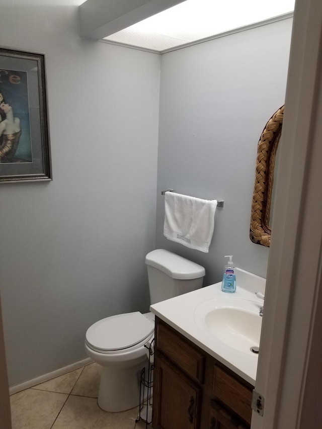 bathroom featuring vanity, toilet, and tile patterned floors