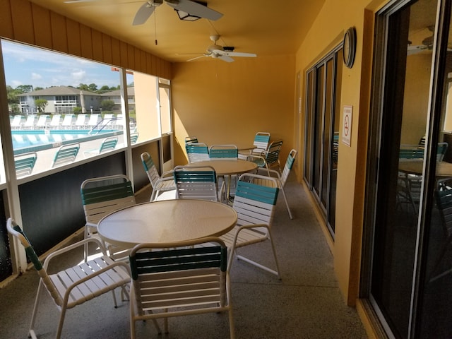 sunroom / solarium with ceiling fan