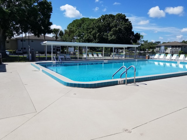 view of swimming pool featuring a patio