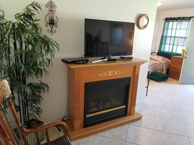 tiled living room with ceiling fan