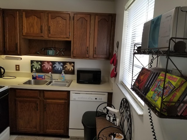 kitchen with white dishwasher and sink