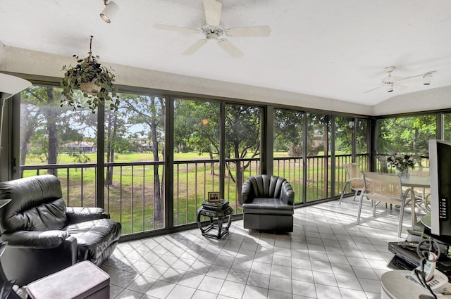 sunroom / solarium featuring ceiling fan and a wealth of natural light