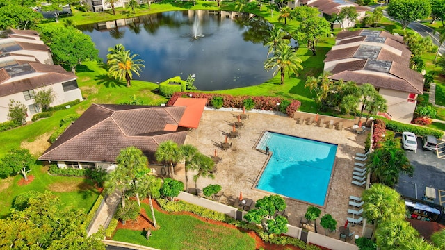 birds eye view of property with a water view