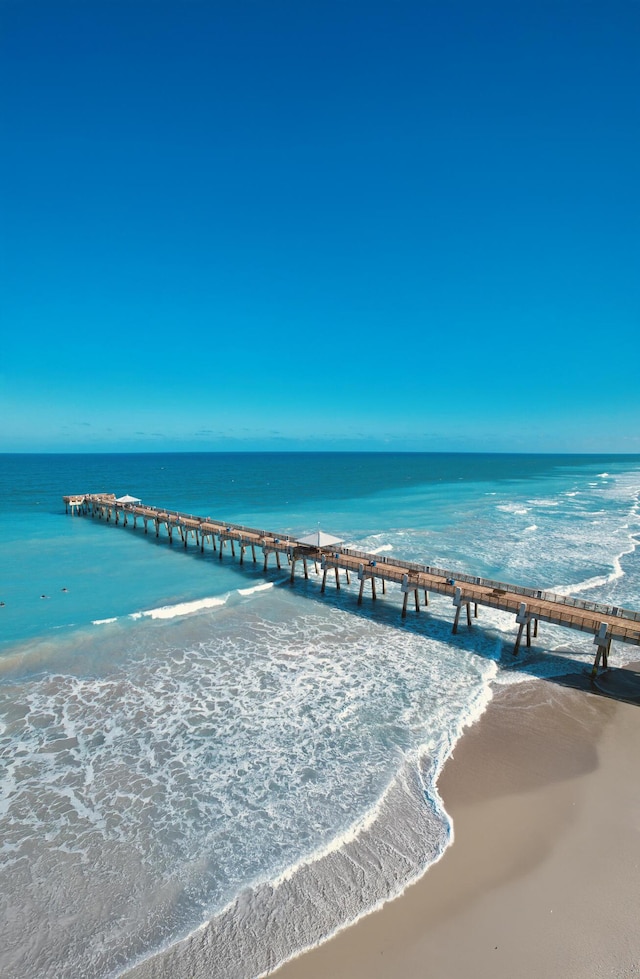 1011 US Highway 1 Unit A202, Juno Beach, FL 33408 - dock area featuring a view of the beach, a water view, and a pier