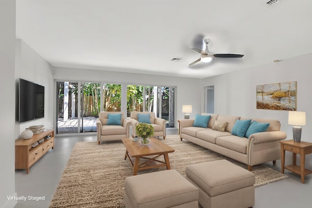 living room with ceiling fan and concrete floors