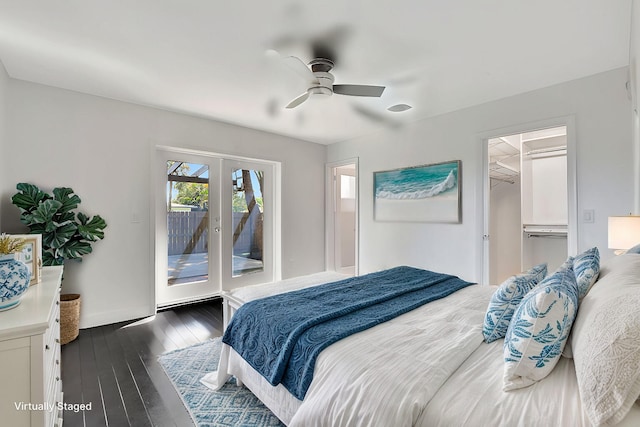 bedroom featuring french doors, ceiling fan, dark hardwood / wood-style floors, a closet, and a walk in closet